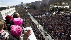 People on the balcony at the Newseum join with protesters on Pennsylvania...