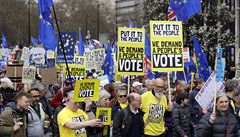 Demonstrators carry posters during a Peoples Vote anti-Brexit march in London,...