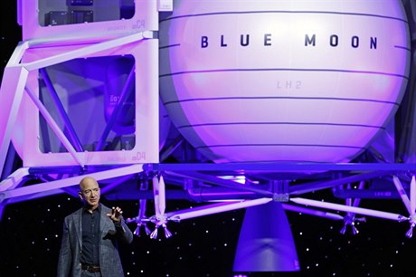 Jeff Bezos speaks in front of a model of Blue Origin's Blue Moon lunar lander,...