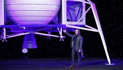 Jeff Bezos speaks in front of a model of Blue Origin's Blue Moon lunar lander,...