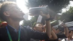 Same-sex marriage supporters cheer with a toast outside the Legislative Yuan...