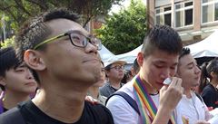 Same-sex marriage supporters cry in cheer outside the Legislative Yuan Friday,...