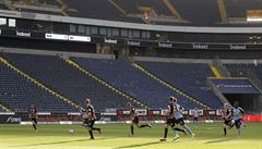 Players vie for the ball during the German Bundesliga soccer match between...