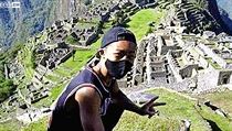 Japonsk turista na vrcholu Machu Picchu.