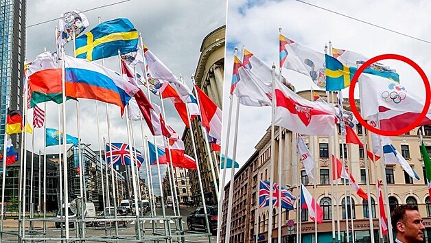 Ruská a historická bloruská vlajka ped hotelem v Rize.