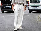 MILAN, ITALY - JUNE 21: A guest wears light gray sheer mesh buttoned up long...