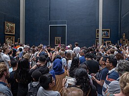 PARIS, FRANCE - AUGUST 22: Visitors take picture of the painting "La Joconde"...